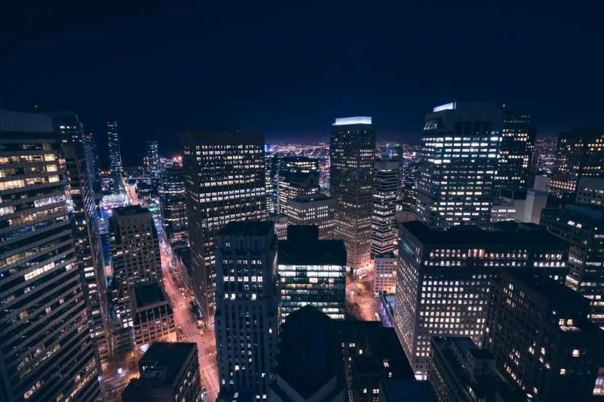 City skyline at night representing a local rental market
